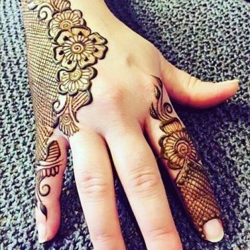 Traditional mehendi designs on back hand side