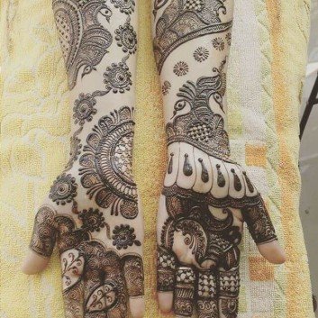 detailed mehandi art for bridals