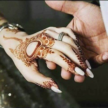 beautiful mehndi art on a girls hands